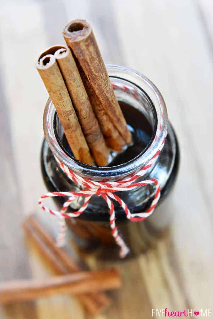 Cinnamon Simple Syrup in glass jar with cinnamon sticks.