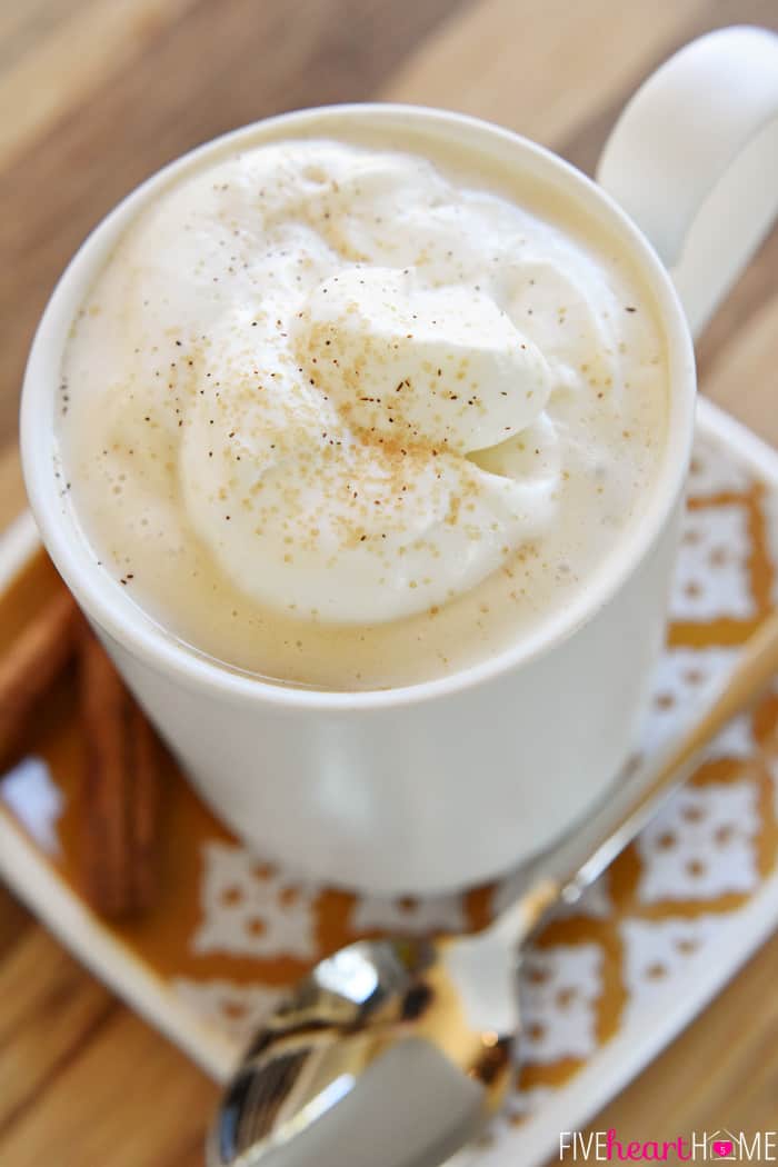 Aerial view of coffee mug with whipped cream on top.