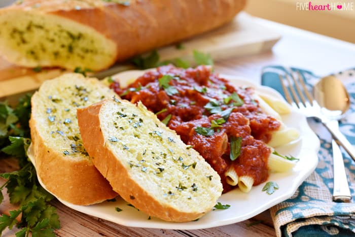 Two Slices on Plate with Pasta 