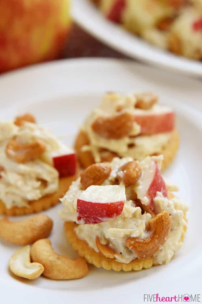 Close-up of Chicken Salad with Apples and Cashews on crackers.