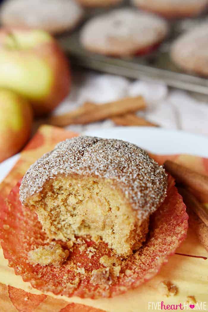 Whole Wheat Apple Cinnamon Muffins are soft and moist, bursting with tender apples, made wholesome by whole wheat flour and coconut oil, and topped with a cinnamon sugar coating | FiveHeartHome.com Missing bite