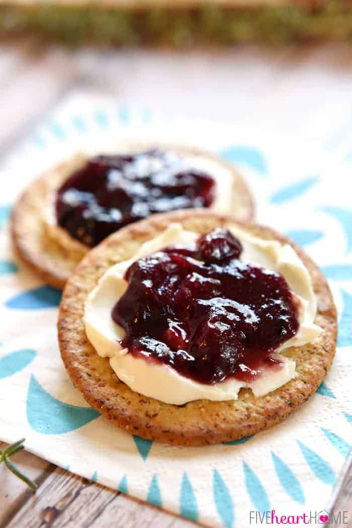 Crackers with cream cheese and Cran-Raspberry Jezebel Sauce. 