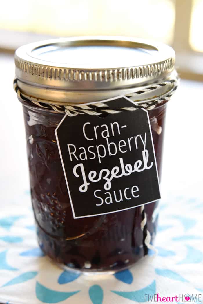 Cran-Raspberry Jezebel Sauce ~ with its bold horseradish kick, this sweet and spicy, versatile sauce can be poured over cream cheese as an appetizer, served alongside holiday ham or turkey as a condiment, or given as a homemade food gift in a jar! | FiveHeartHome.com
