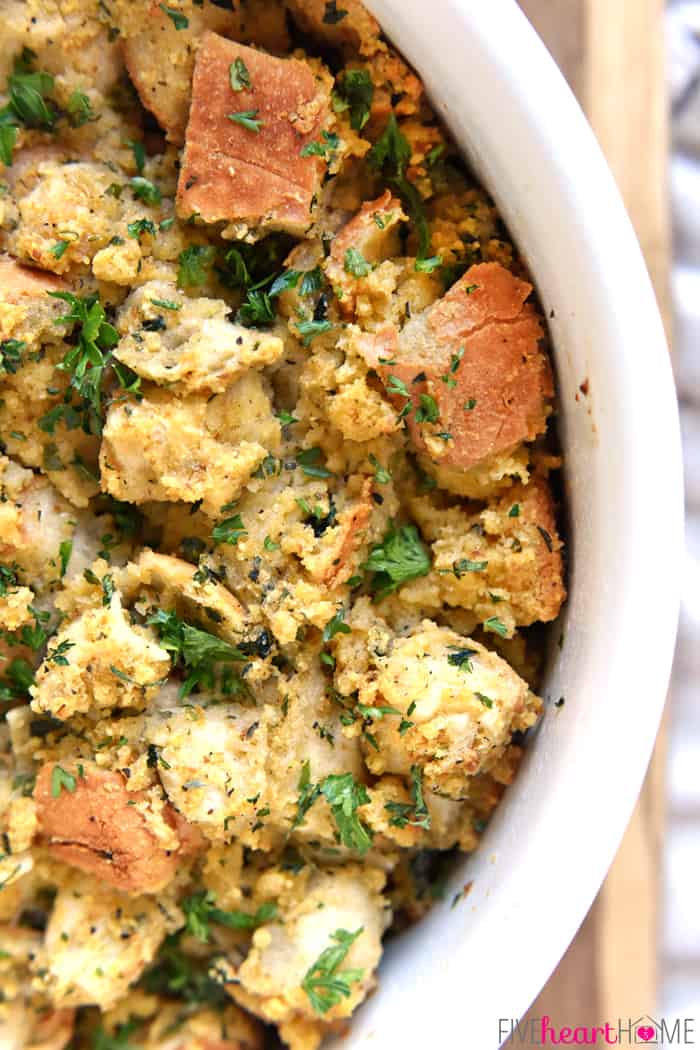 Ultimate Cornbread Stuffing ~ made with French bread and cornbread, this AMAZING Thanksgiving dressing recipe is easily customizable with garlic, your favorite herbs, and add-ins! | FiveHeartHome.com Aerial view of Cornbread Stuffing baked in dish.