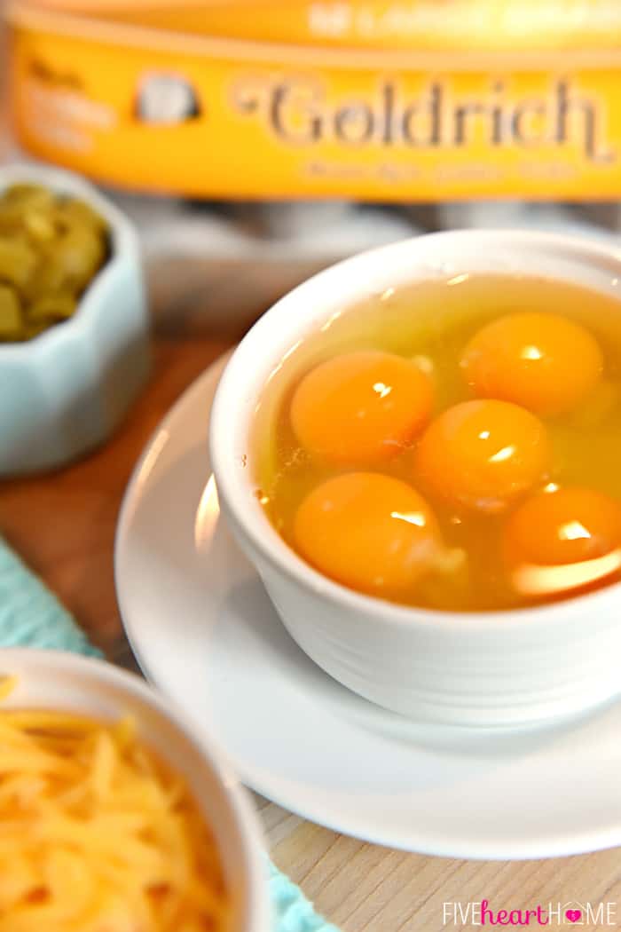 Bowl of Raw Eggs, Bowl of Shredded Cheddar and Bowl of Green Chiles 