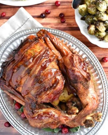 Maple-Glazed Turkey with Bacon and Sage Butter ~ tender, juicy, and shingled with bacon, this is the BEST Thanksgiving turkey recipe you'll ever try! | FiveHeartHome.com