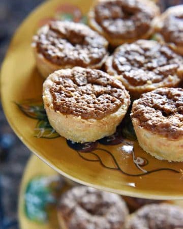 Mini Pecan Pies ~ flaky, tender crust requires no rolling and the nutty, sugary filling calls for only 5 ingredients, making these a perfect addition to your Thanksgiving dessert table! | FiveHeartHome.com