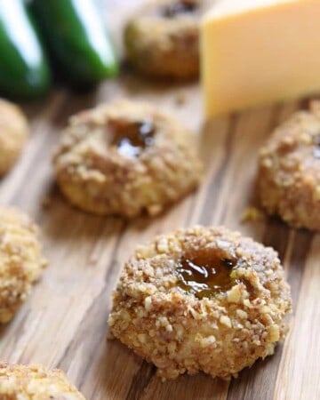 Cheddar Jalapeño Jelly Thumbprints ~ these savory appetizers are bursting with sharp cheddar and filled with sweet and spicy jalapeño jelly for a fun twist on classic thumbprint cookies | FiveHeartHome.com