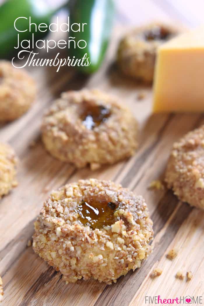 Savory Thumbprint Cookies ~ delicious appetizers bursting with sharp cheddar cheese and filled with sweet and spicy jalapeño jelly for a fun twist on classic thumbprint cookies! | FiveHeartHome.com via @fivehearthome