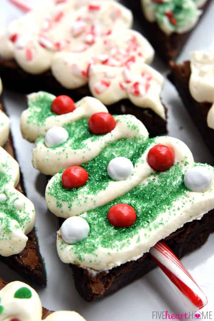 Close-up of Christmas Tree Brownies decorated with sprinkles and candy canes.