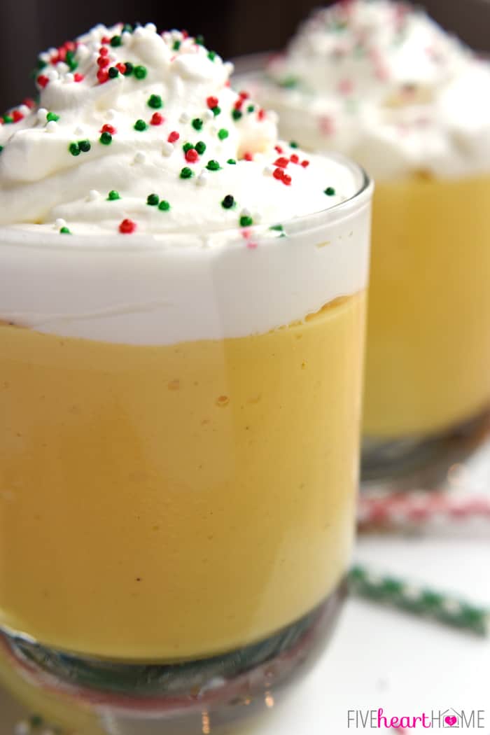 Two Glasses with Layers of Pudding and Whipped Cream with Sprinkles 