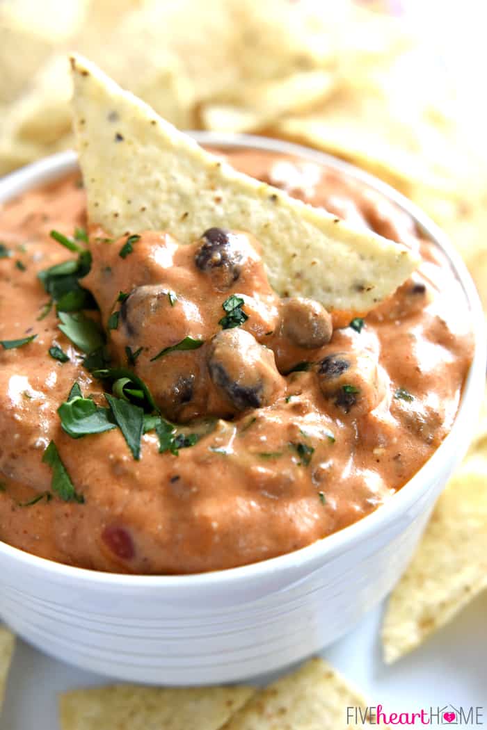 Tortilla chip stuck down in bowl of Chili Cheese Dip