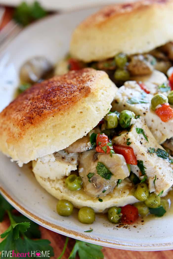 On a serving plate piled on a biscuit.