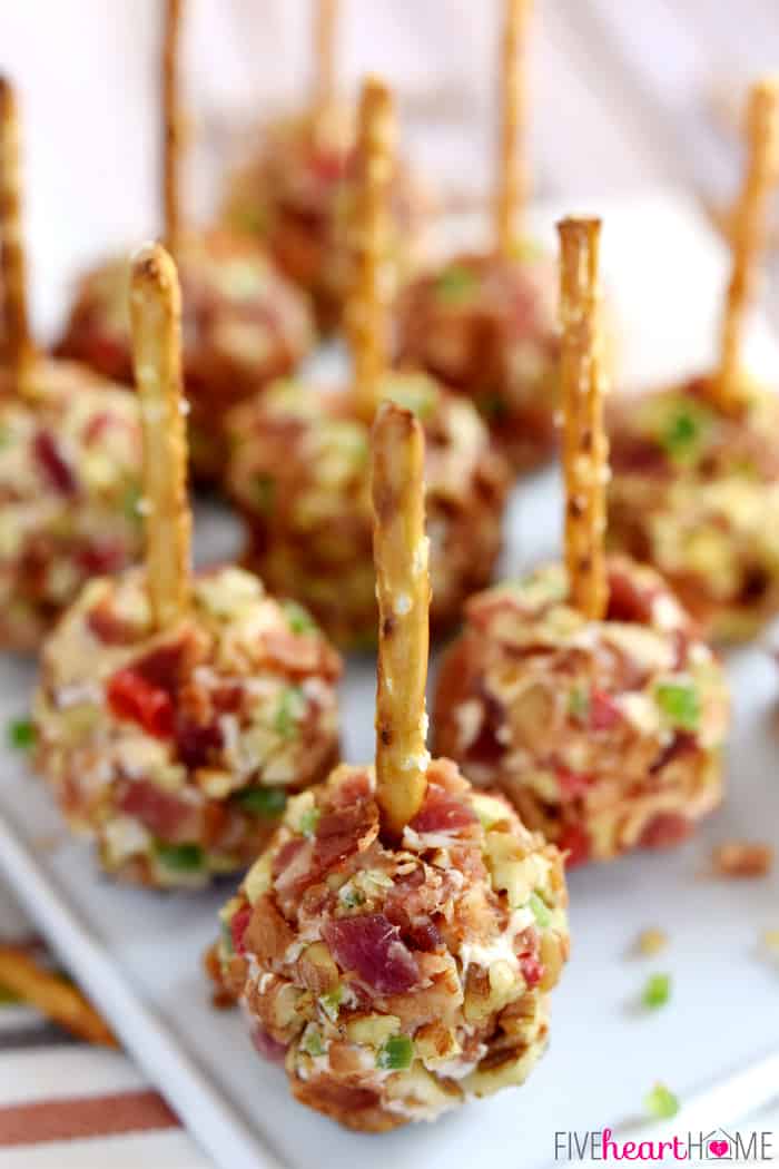 Pimento Cheese and Bacon Mini Cheese Ball Bites close-up with pretzel stick skewers.
