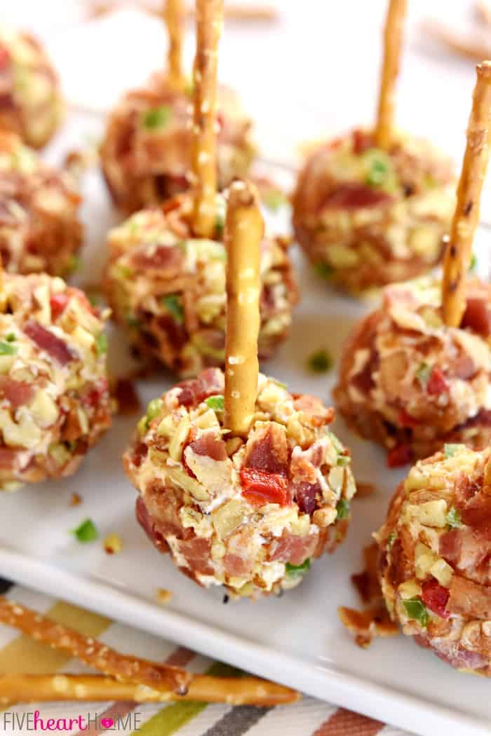 Tray of Pimento Cheese Balls with pretzel skewers.