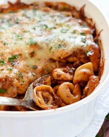 Bake Tortellini in baking dish with serving spoon.