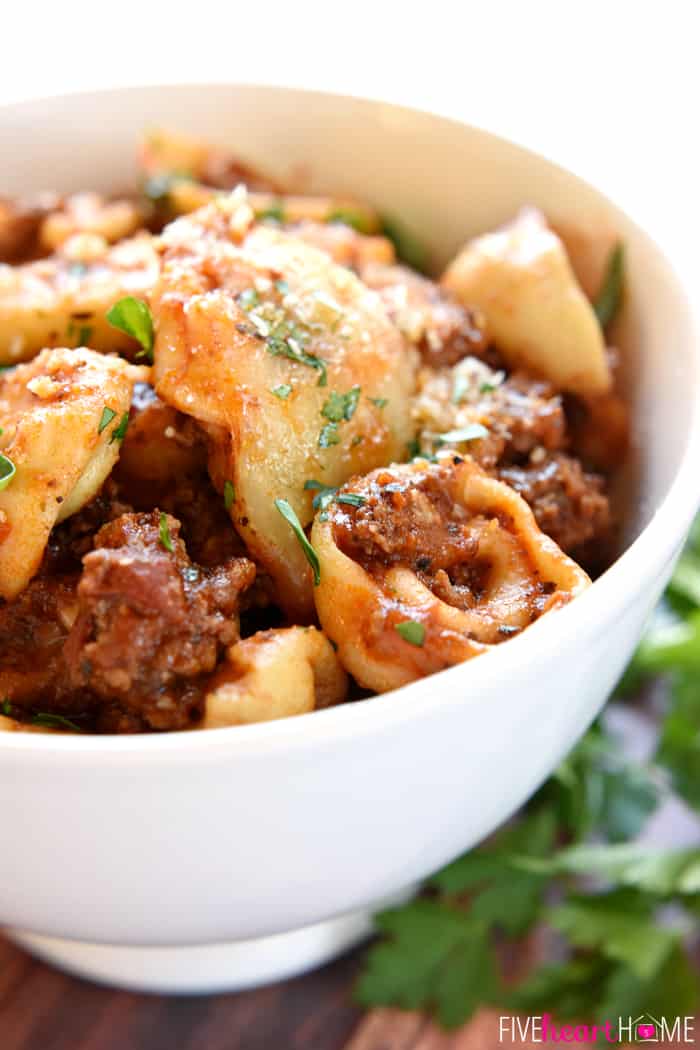 Baked Tortellini served in a white bowl.