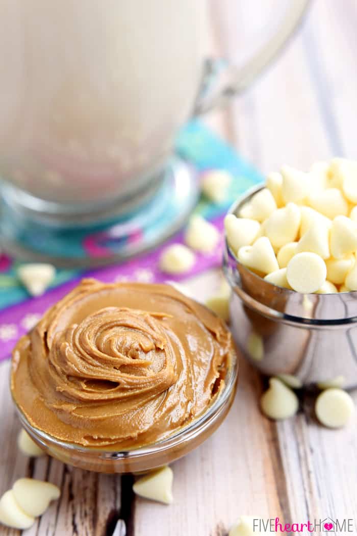 Biscoff Spread in Small Bowl with a Metal Tin of White Chocolate Morsels 