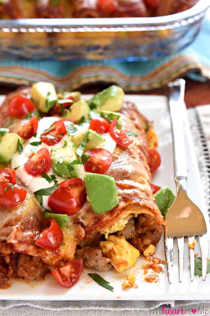 Perfect Bite Removed From Breakfast Enchiladas on White Plate with Silver Fork 