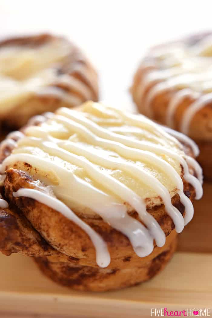 Cream Cheese Filled Cinnamon Roll Cups ~ fit refrigerated cinnamon rolls in a muffin pan, fill with sweetened cream cheese, bake until golden, and then drizzle with icing for a fun, easy, special breakfast treat! | FiveHeartHome.com Cream Cheese Filled Cinnamon Roll Cups Drizzled with Icing
