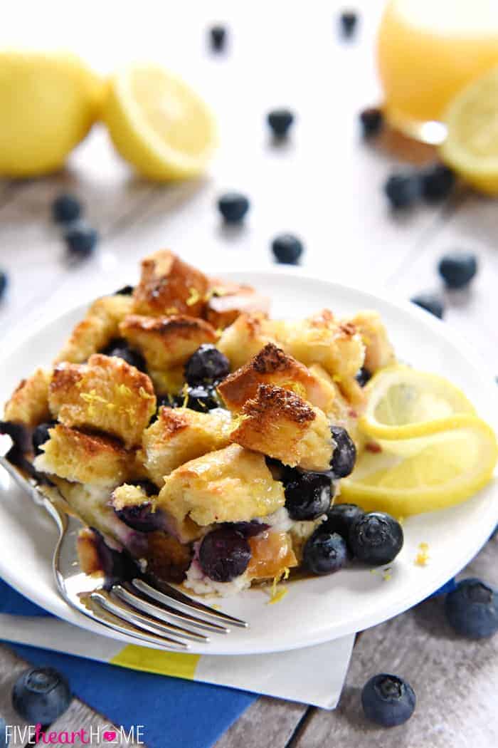 Serving of Lemon Blueberry Overnight Baked French Toast with Lemon Syrup on White Plate 