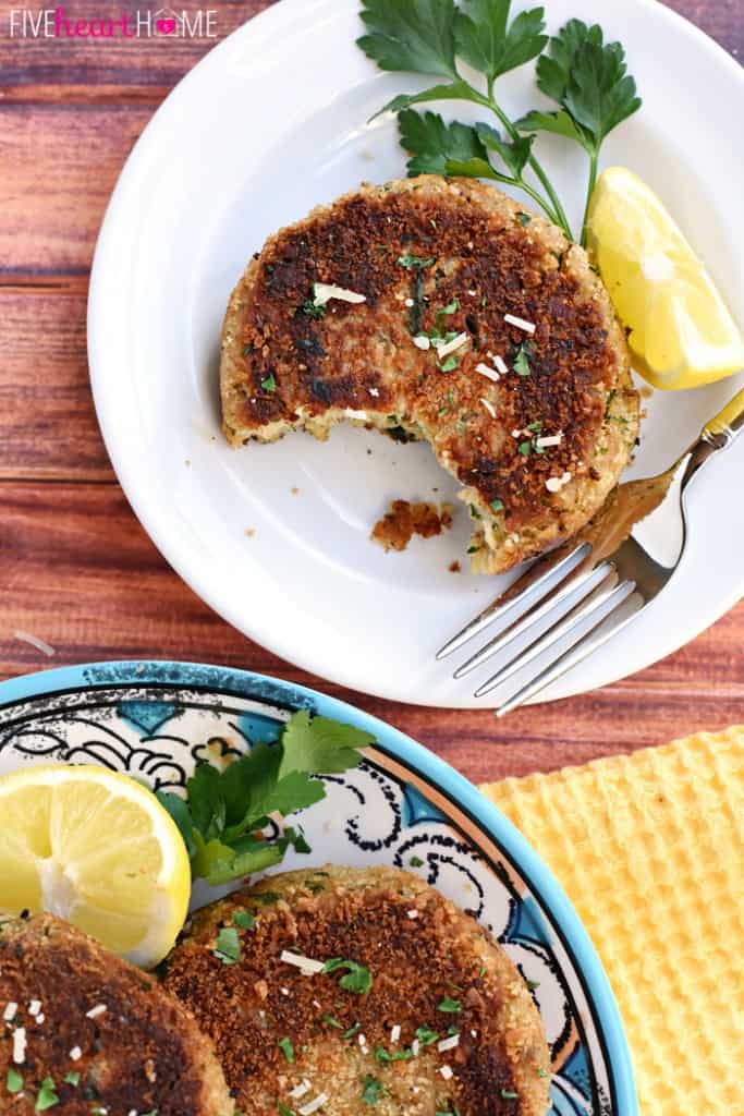 Aerial view of Salmon Patties on plate with missing bite.