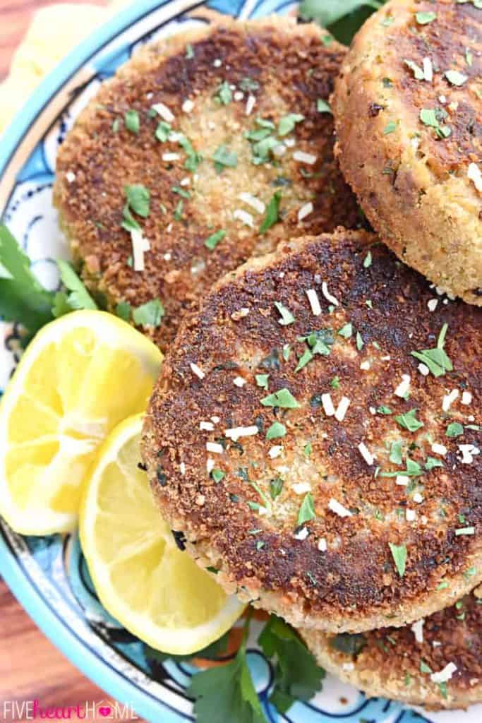 Salmon Cakes on platter with lemons.