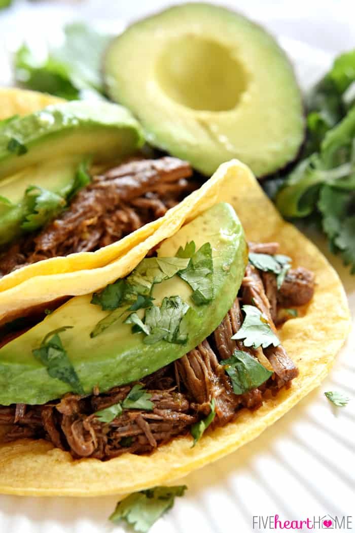 Slow Cooker Beef Barbacoa ~ flavored with smoked chipotles in adobo, fresh garlic, cilantro, and Mexican spices, this tender, juicy meat is an ideal filling for tacos, burritos, and quesadillas, or a tasty topping for rice bowls and salads | FiveHeartHome.com