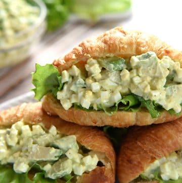 Avocado Egg Salad in croissants on serving platter.