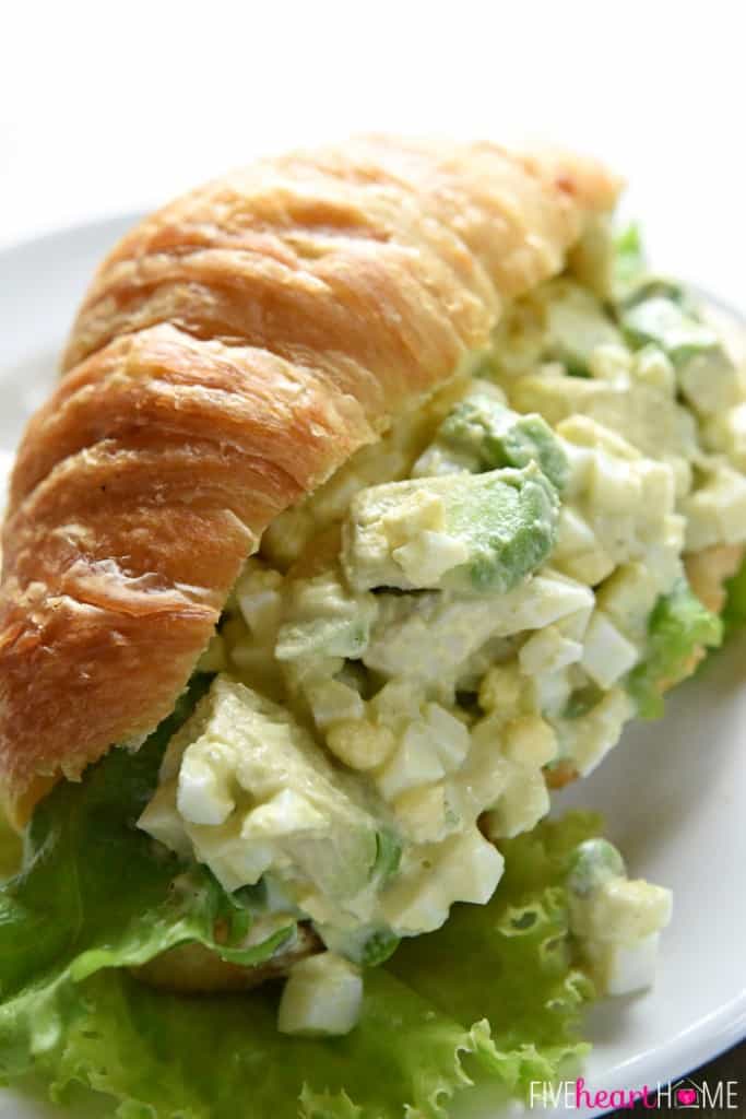 Close-up of Avocado Egg Salad on croissant.