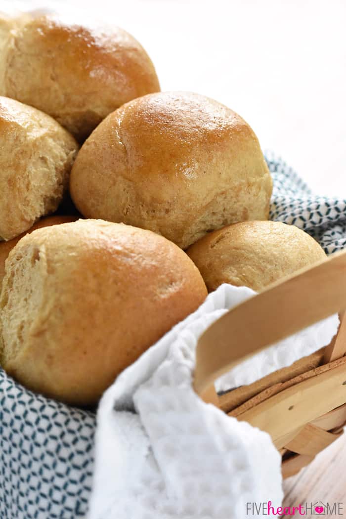 Whole Wheat Dinner Rolls in a towel-lined basket.
