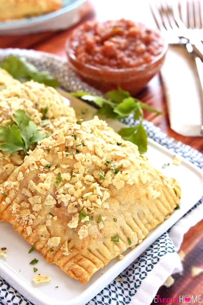 Creamy Chicken Taco Hand Pies on White Plate with Fresh Cilantro Garnish 