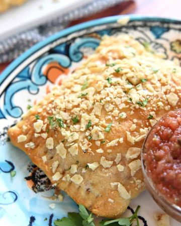 Creamy Chicken Taco Hand Pies ~ crescent roll dough filled with a savory mixtures of diced chicken, cream cheese, taco seasoning, and fresh cilantro, and topped with a crunchy layer of crushed tortilla chips | FiveHeartHome.com