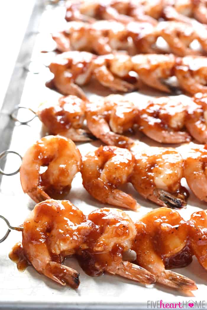 Skewers of Honey Garlic Shrimp on a baking sheet