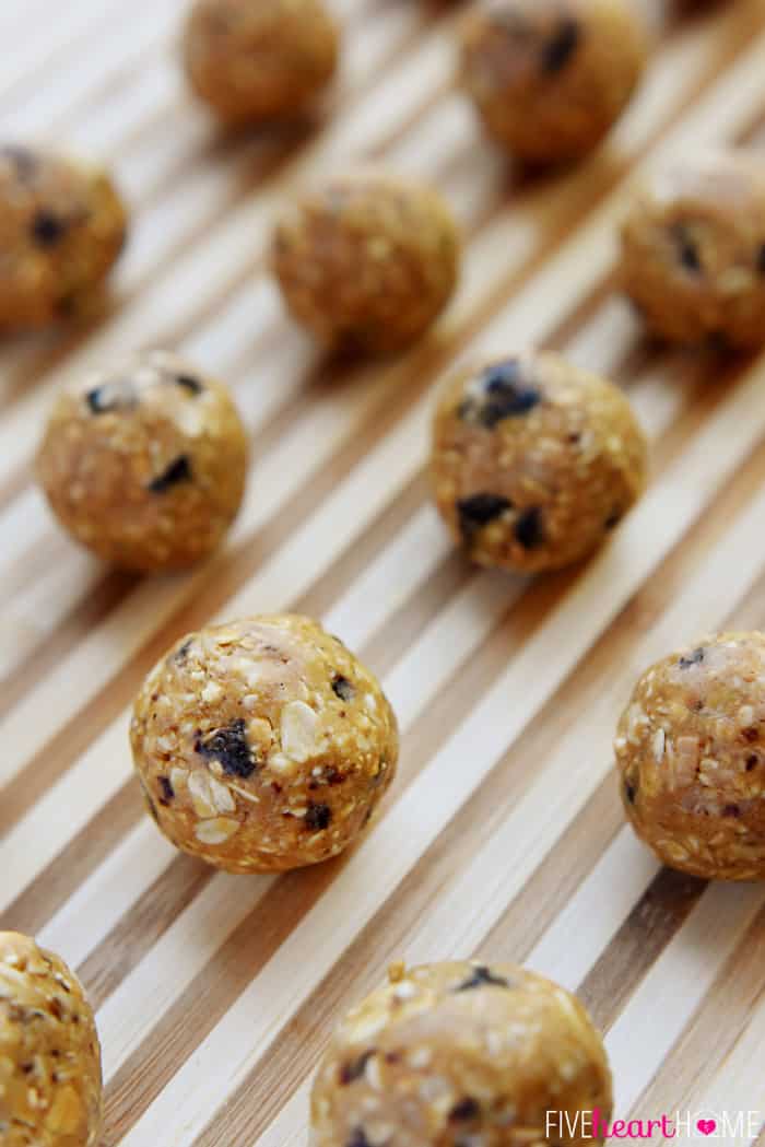 Oatmeal Energy Bites lined up on striped board.