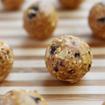 Oatmeal Cookie Energy Bites ~ tasty, no-bake balls combining oats, ground nuts, dried fruit, nut butter, and honey...perfect as a portable breakfast-on-the-go, a protein-packed snack, or a no-guilt-necessary sweet treat! | FiveHeartHome.com