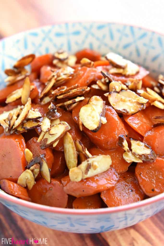 Orange Apricot-Glazed Carrots with Candied Almonds ~ sweet and tender, glossy and vibrant...and the perfect spring side dish for Easter dinner! | FiveHeartHome.com Orange Apricot-Glazed Carrots with Candied Almonds in Decorative Bowl