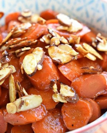 Orange Apricot-Glazed Carrots with Candied Almonds ~ sweet and tender, glossy and vibrant...and the perfect spring side dish for Easter dinner! | FiveHeartHome.com