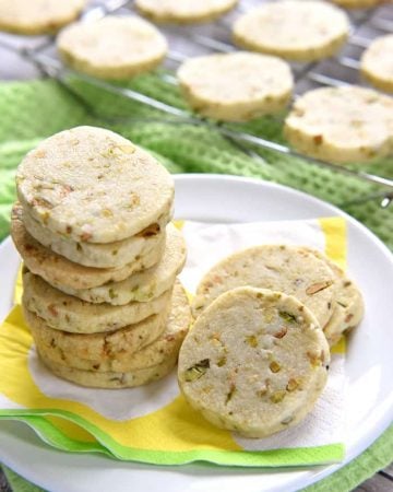 Pistachio Shortbread Cookies ~ delicately sweet and studded with salty pistachios, these easy-to-make cookies can be filled with lemon curd, fruity jam, or Nutella for fun and tasty sandwich cookies | FiveHeartHome.com