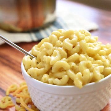Homemade One-Pot Stovetop Macaroni and Cheese in a white bowl with a spoon