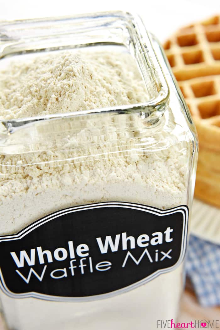Homemade Whole Wheat Waffle Mix ~ an economical pantry staple for conveniently whipping up fluffy, all-natural, 100% whole wheat waffles! | FiveHeartHome.com Waffle Mix in labeled glass jar.