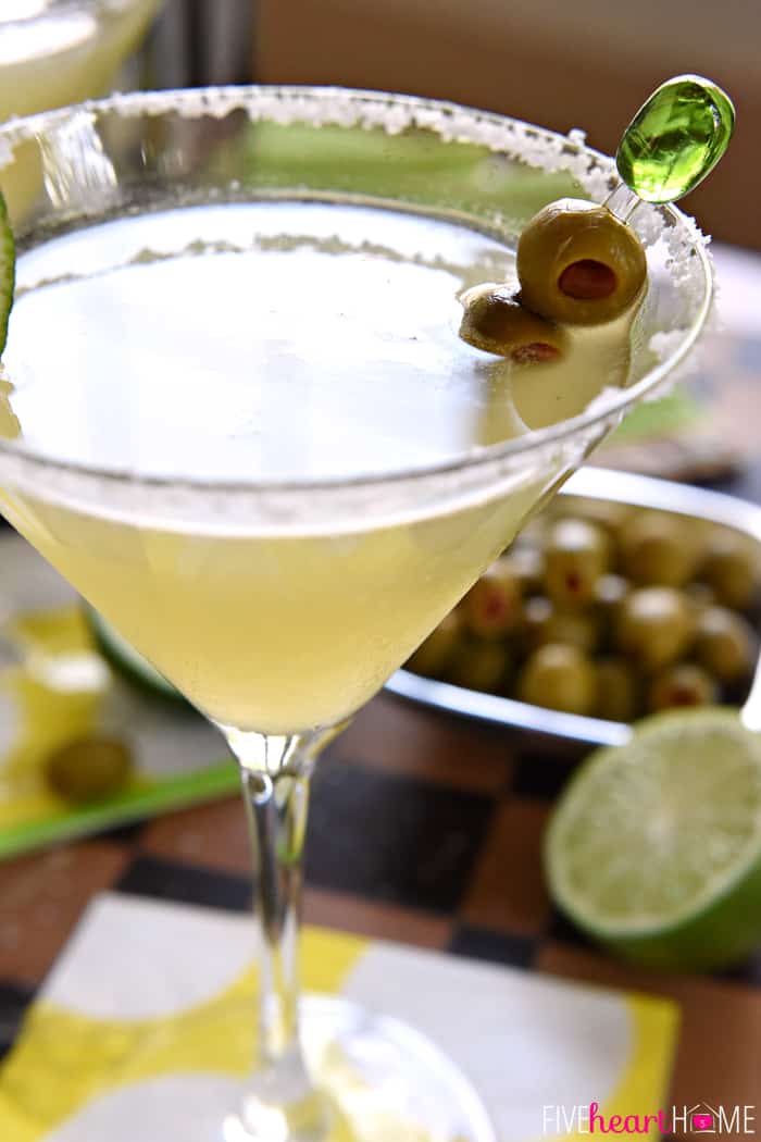Close-up of Mexican Martini in glass with olive pick.