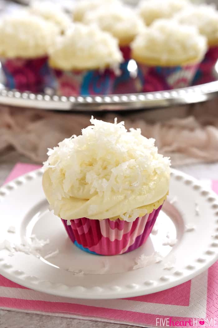 Coconut Cupcakes on serving platter and small white plate.
