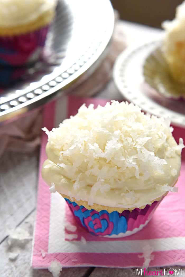 Coconut Cupcakes on pink napkin and pewter serving platter.