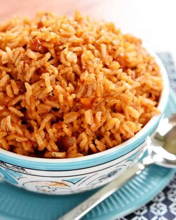 Easy Spanish Rice ~ cook a pot of rice using chicken broth, tomato sauce, and a few seasonings to make this quick and easy Spanish Rice...it's the perfect base for rice bowls or a delicious side dish to your favorite Mexican entrees! | FiveHeartHome.com