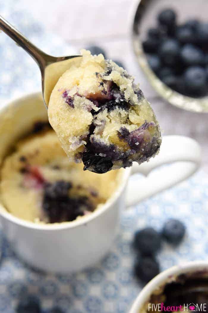 Spoonful of Blueberry Muffin Mug Cake scooped out of mug.