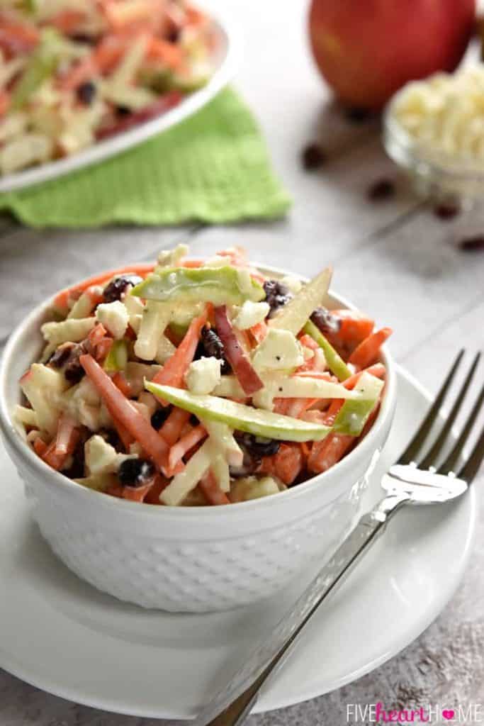 Carrot Apple Slaw ~ with crunchy carrots, sweet and tart apples, dried cranberries, salty feta cheese, and a creamy dressing, this salad is a refreshingly sweet and savory side dish for summer! | FiveHeartHome.com