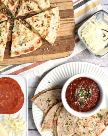 Pizza Quesadillas with Dipping Sauce ~ cheesy, melty quesadillas are stuffed with mozzarella and pepperoni and dipped in a flavorful, herb-infused, homemade pizza sauce for a fun, quick, and easy lunch idea! | FiveHeartHome.com