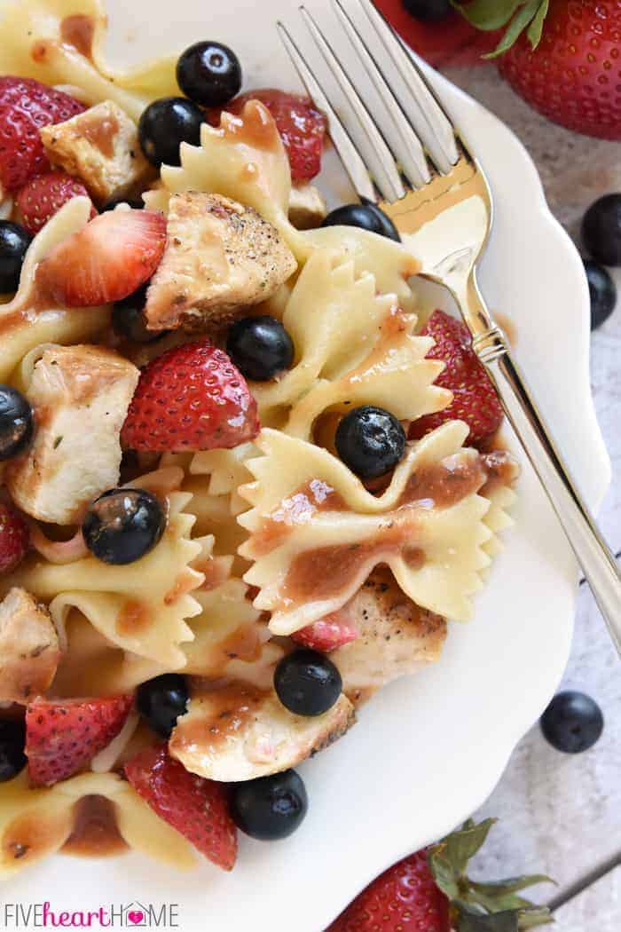 Chicken Berry Pasta Salad ~ a sweet and savory summer dish drizzled with fresh Strawberry Balsamic Vinaigrette...and with its red, white, and blue color scheme, it's the perfect recipe for 4th of July picnics, potlucks, and BBQs! | FIveHeartHome.com