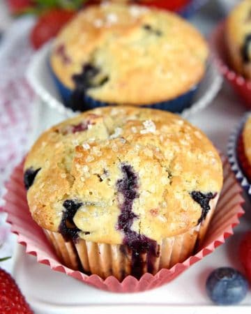 Mixed Berry Cream Cheese Muffins ~ bursting with fresh strawberries, blueberries, and raspberries…as well as a surprise swirl of cream cheese filling! | FiveHeartHome.com